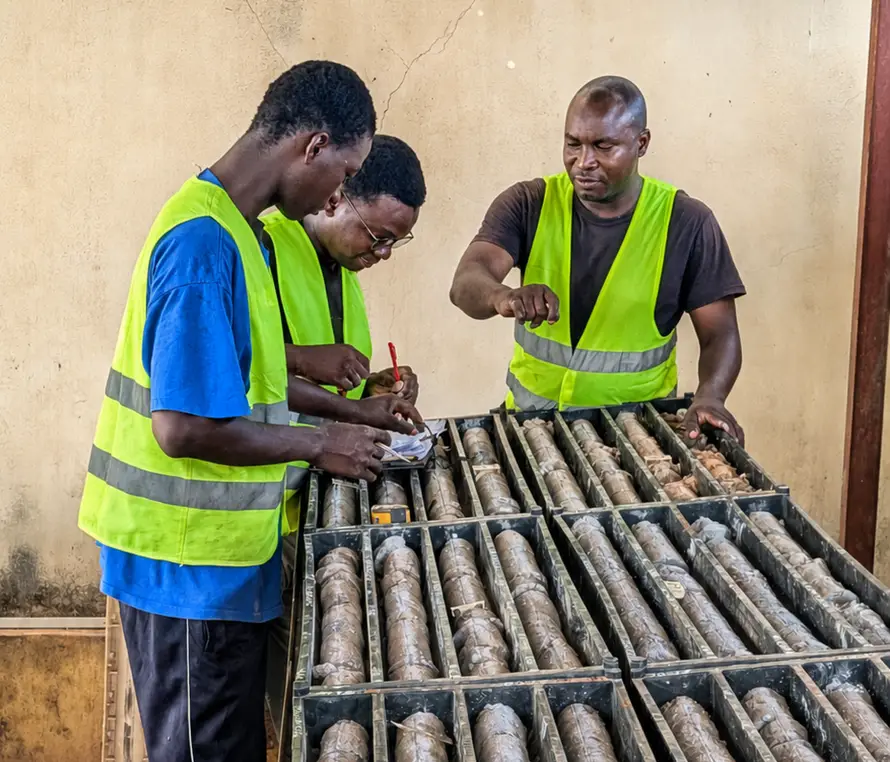 Compass geologists logging drill core at the Sikasso Property core facility