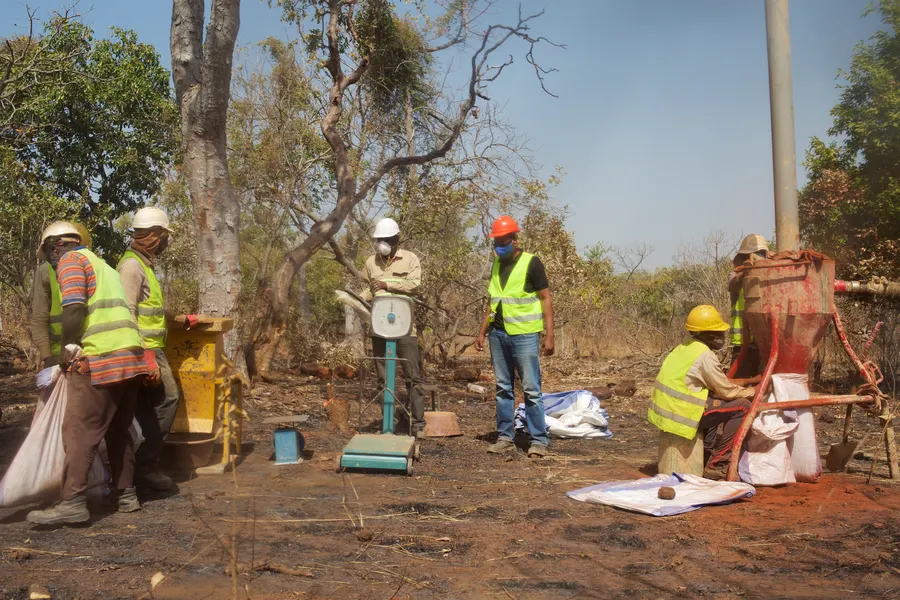 Bulk sampling crew weighing samples in the field